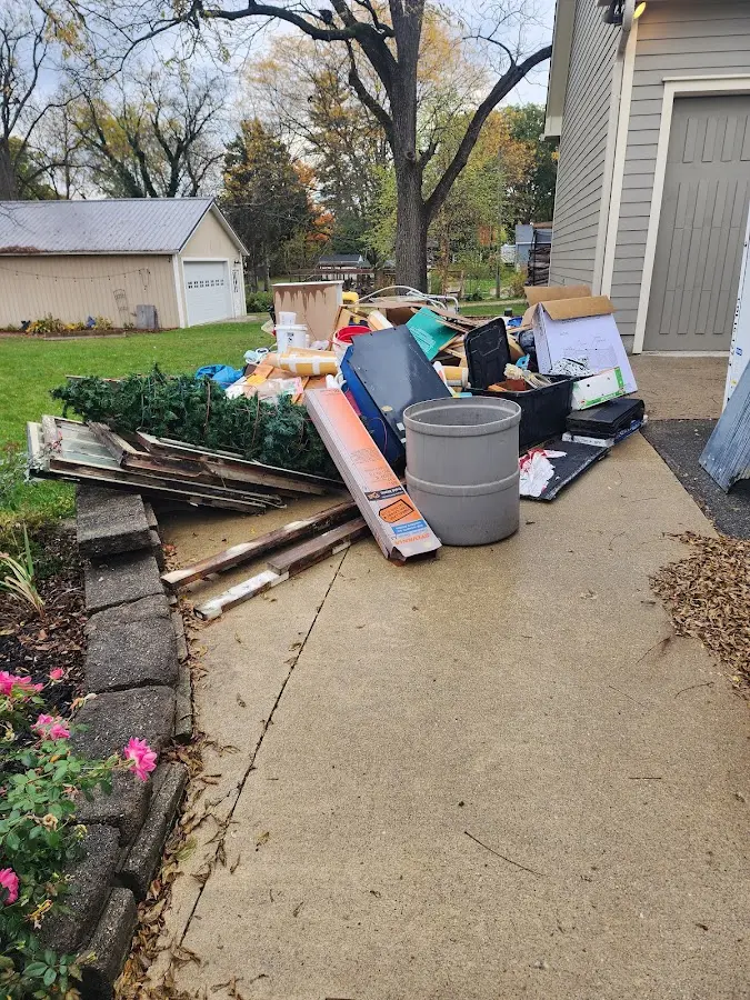 Dumpster being loaded with debris for 30 Yard Dumpster Rental in Blanchard